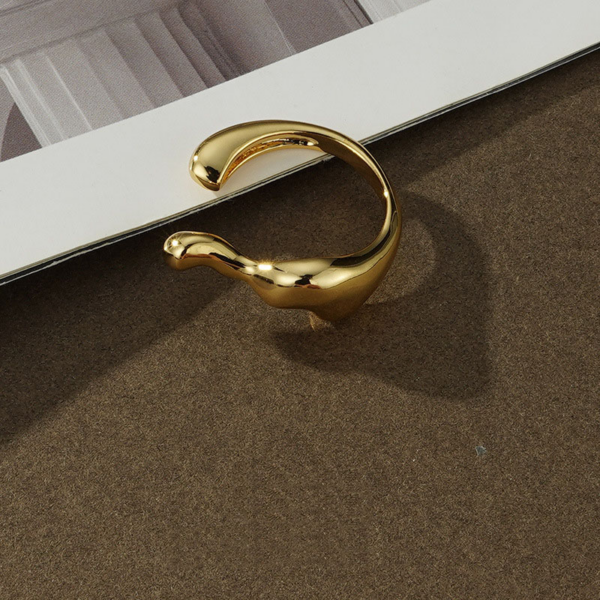 Elegant Streamline Split Ring - Golden Color, the shape like steam. This ring features a sleek, modern design characterized by its unique wavy shape. Crafted in a shiny gold finish, it showcases a combination of smooth and sculptural elements, giving it a contemporary feel. The open band allows for an adjustable fit, making it both stylish and comfortable for everyday wear. This eye-catching piece is perfect for adding a touch of elegance and artistic flair to any outfit.